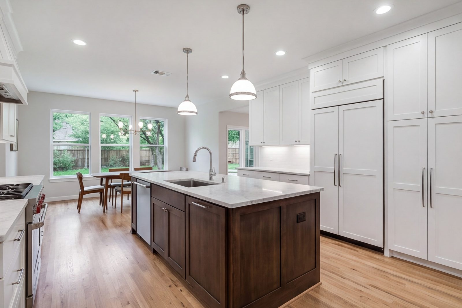 Haltom City kitchen with an island, tall cabinets and under-cabinet lighting